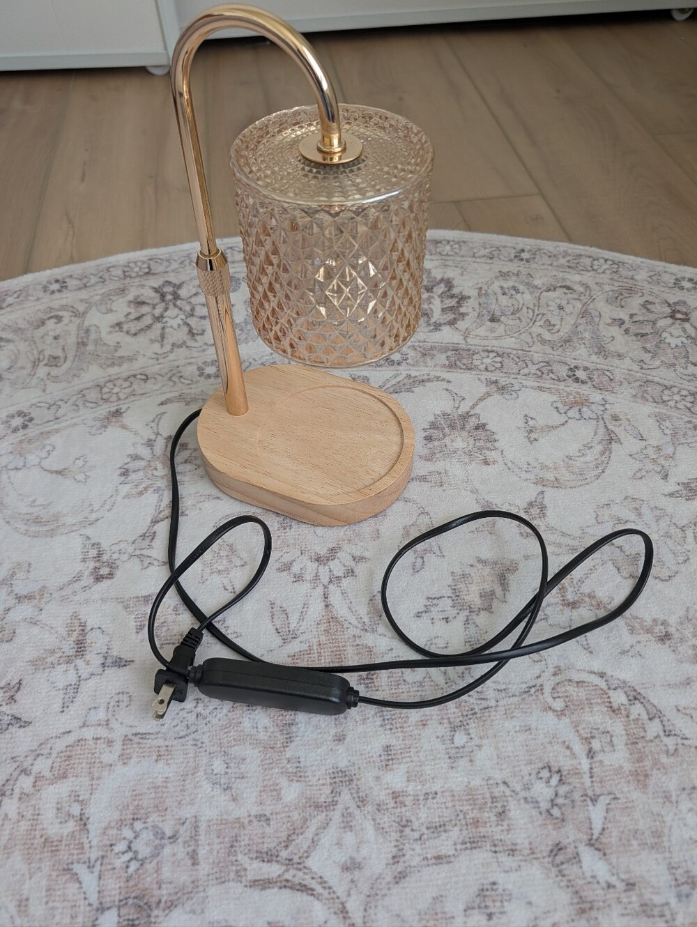 Beautiful candle warmer lamp featuring a textured glass shade, gold-tone